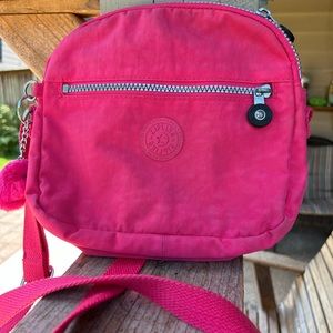Kipling Pink crossbody 9.5” by 9”. Good condition zip top